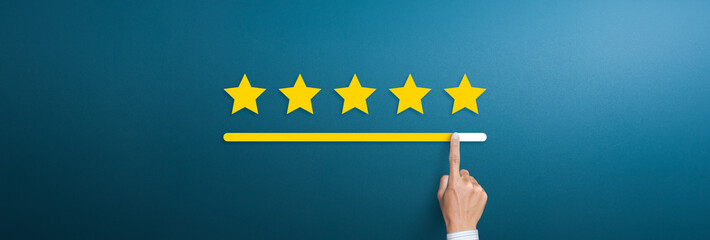 Customer service evaluation and satisfaction survey concepts. Hand with pointing finger pointing to rating stars - obrazy, fototapety, plakaty
