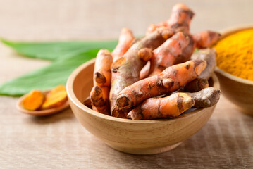 Fresh turmeric and turmeric powder (Curcuma, curcumin), Organic ingredient in Asian cuisine