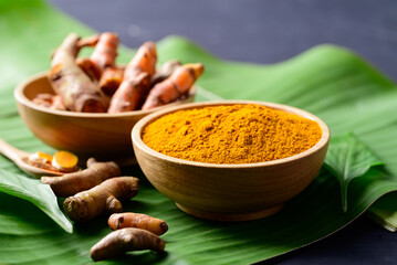 Turmeric powder and fresh turmeric (Curcuma, curcumin), Food ingredient in Asian cuisine
