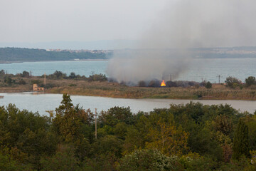 Fototapeta na wymiar Fire at Atanasovsko lake, Burgas, Bulgaria, 1st of October 2023.