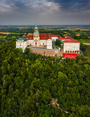 Pannonhalma, Hungary - Aerial view of the beautiful Millenary Benedictine Abbey of Pannonhalma (Pannonhalmi Apatsag) with clear blue sky and green summer foliage at summertime
