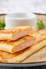 pancakes with ham on plate