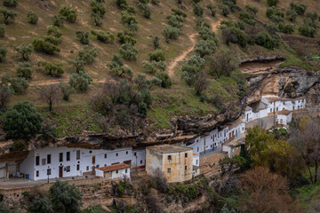 Setenil de las Bodegas, white village with its houses built into a rock mountain, Andalusia, Spain © Katerina