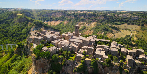 Approaching medieval town of Civita di Bagnoregio from a drone, Italy. - obrazy, fototapety, plakaty