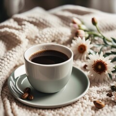 Cup of Coffee on a Cozy Blanket