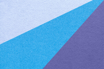 Fototapeta premium Texture of old craft light blue, cerulean and violet color paper background, macro. Vintage abstract cardboard