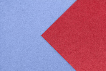 Fototapeta premium Texture of blue paper background, half two colors with red arrow, macro. Structure of craft very peri cardboard.