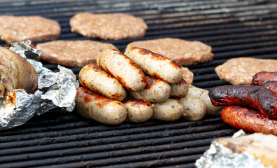 Sausages are fried on the grill