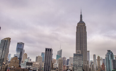 Fototapeta premium New York City - June 2013: The Empire State Building is a city symbol