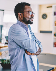 Confident black man in library