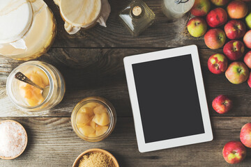 Making homemade apple cider vinegar, digital tablet on table
