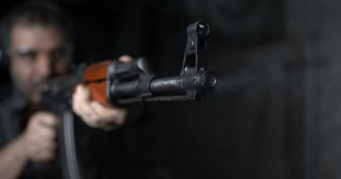 Close-up of AK-47 Rifle shooting in high-speed 800 fps. Firing Kalashnikov weapon in slow-motion