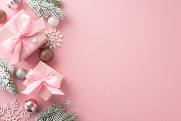 Glamorous Christmas Decor. Top view shot featuring gift packages, charming tree decorations, radiant baubles, snowflake details, frosty pine branches on pastel pink backdrop, ideal for greeting or ads