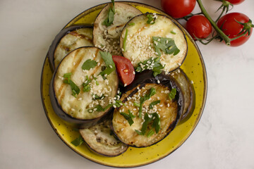 Fried grilled eggplants with tomatoes