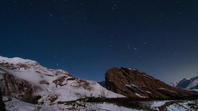 Discover captivating wonderful scenic moonset timelapse starry sky iconic snow-capped Alamut Assassin Castle gracing Iran breathtaking landscape adventure natural beauty freezing cold winter night