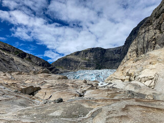 Frontal view of a tongue of blue ice from a glacier