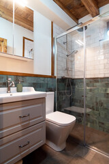 Interior of light modern bathroom in minimalist style with glass shower