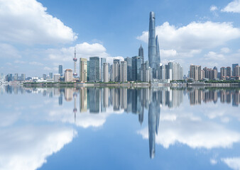 Illuminated Shanghai Skyline Reflecting On River