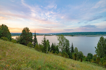 Morning landscape panoramic view of the river from the hill Sunrise highlights the clouds purple. - 659357781