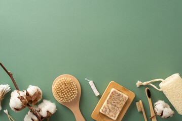 Eco-Friendly Essentials: Top view of sustainable bamboo toothbrushes, cotton buds, anticellulite brush, homemade soap, and more on green backdrop with space for your message or advertising - obrazy, fototapety, plakaty