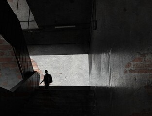 single silhouetted youth in inner city walkway design grunge textured style monochrone