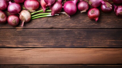 On a wooden background, there are shallots.