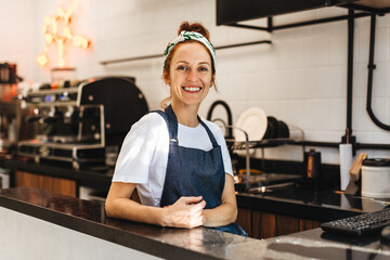 Successful small business owner working in her coffee bar