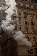 steam pipe and vintage building on street in downtown of new york city, metropolis atmosphere