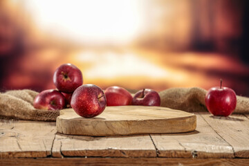 Fresh red apples and autumn landscape.  - Powered by Adobe
