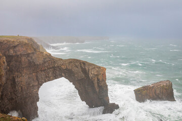 The Green bridge of Wales on the Pembrokeshire coast UK during storm Agnes