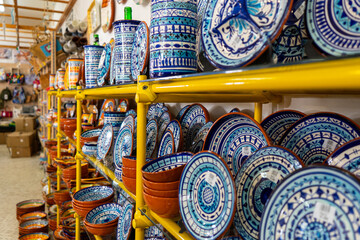 Traditional portuguese earthenware cups, bowls and others from varnished baked clay in Lagos, Portugal  - obrazy, fototapety, plakaty