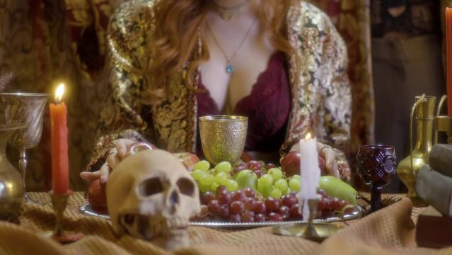 Enchanting Witchcraft: Redheaded Sorceress at Table with Skull and Wine