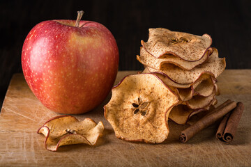 in the foreground homemade dried apple slices flavored with cinnamon