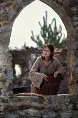 Maid in the Middle Ages on castle ruins