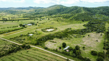 Fototapeta na wymiar Aerial view of farm land near Calliope with dam and farm, Queensland, Australia.