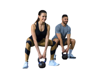 Fit and muscular couple focused on lifting a dumbbell during an exercise class on a transparent background