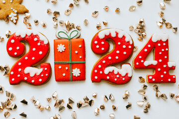 Christmas and New Year banner gingerbread cookies numbers 2024 on white background with copy space