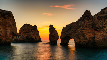 Scenic sunrise landscape of Algarve beach with wonderful rock formation, Ponta da piedade, Algarve,...