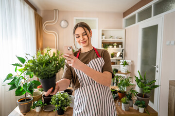 One young woman take care of plant and photos with her smartphone