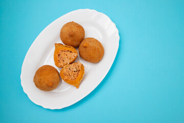 traditional fried coxinha on a plate
