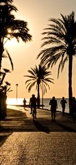 Promenade next to the beach at sunrise in Santa Pola - obrazy, fototapety, plakaty