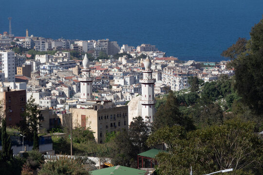 Beautiful panorama of Algiers, Alger, Algeria, with the Ennour Mosque in the foreground and the blue Mediterranean sea in the background.