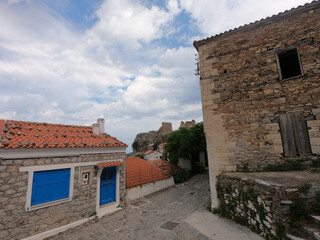 Fototapeta premium Old houses and shops in mountain village Chora on the island Samothrace, Greece, in Aegean sea.