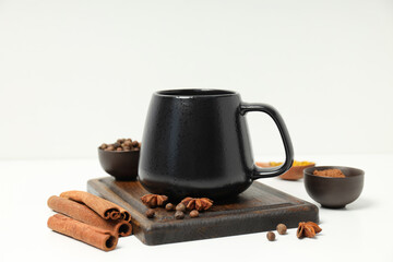 Masala tea and spices on wooden board on white background