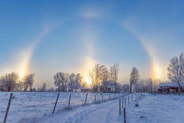 Cold winter day with a halo and sun dogs in the countryside