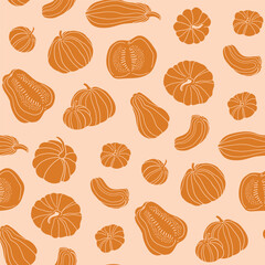 Pumpkin stylish seamless pattern. Autumn orange food fabric design in hand-drawn style. Whole and slices of pumpkin isolated on pastel orange background.  - 659417556