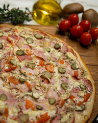 Delicious Pizza with tomatoes, cheese, bacon