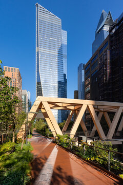 High Line Park timber wooden truss bridge with Hudson Yards skyscrapers. Chelsea, Manhattan, New York City