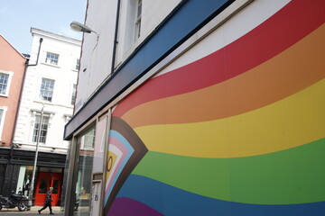 LGBTIQA+ flag on a wall