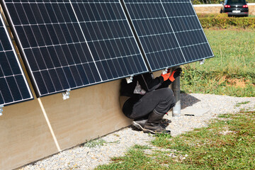 Solar panels on a well-exposed wall of an individual house, making savings following the energy...